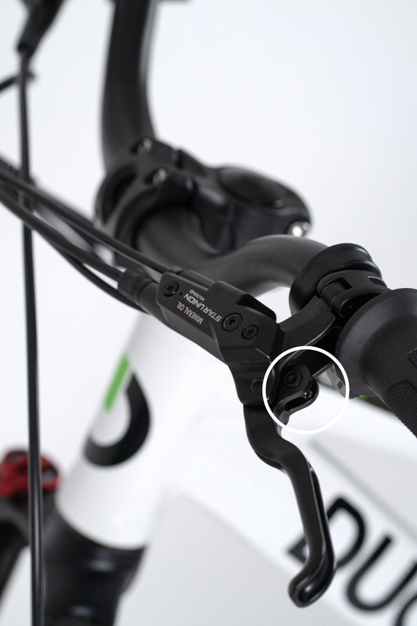 Hydraulic front & rear disc brakes – lever & caliper close-up”