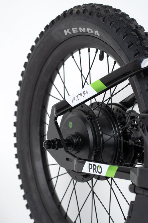 Close-up of a bicycle wheel with Kenda tire and Pro hub on a white background