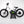“DUO 20″ Podium Pro kids electric balance bike – side profile, black, on stand”