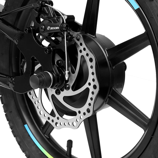 Close-up of a Amped A16 Children's electric balance bike wheel with disc brake system on a white background